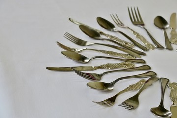kitchen set of spoons forks and knives on a white background