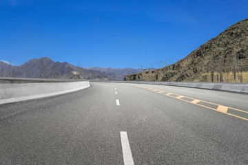 Empty highways and distant mountains