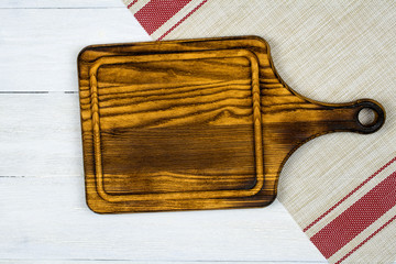 Cutting board lies on a light background with two red stripes.