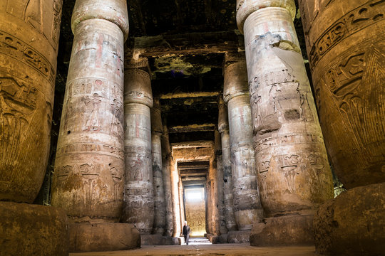 Man walking through Temple of Seti I, Abydos, Egypt