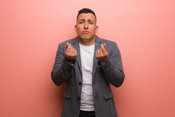 Young elegant latin man doing a gesture of need