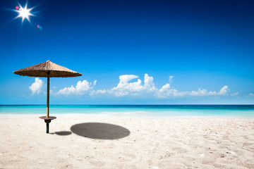 Beach background of free space and umbrella 