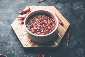 Schezwan Sauce / Szechuan chutney is an important ingredient in Chinese recipe. served in a bowl, isolated.  selective focus