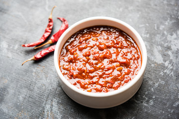 Schezwan Sauce / Szechuan chutney is an important ingredient in Chinese recipe. served in a bowl, isolated.  selective focus