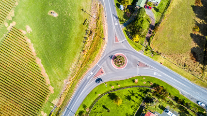 Road intersection surrounded by small farms and vineyards. Auckland, New Zealand © Dmitri