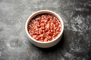 Schezwan Sauce / Szechuan chutney is an important ingredient in Chinese recipe. served in a bowl, isolated.  selective focus