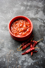 Schezwan Sauce / Szechuan chutney is an important ingredient in Chinese recipe. served in a bowl, isolated.  selective focus