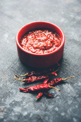 Schezwan Sauce / Szechuan chutney is an important ingredient in Chinese recipe. served in a bowl, isolated.  selective focus