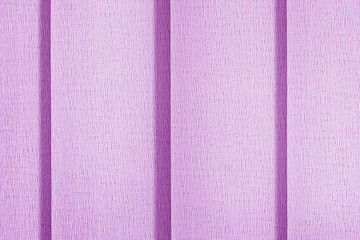 Fototapeta premium Textile background of lilac color. Shutters, curtains vertical blinds.