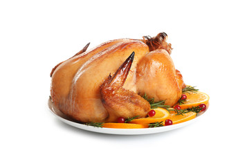 Platter of cooked turkey with garnish on white background
