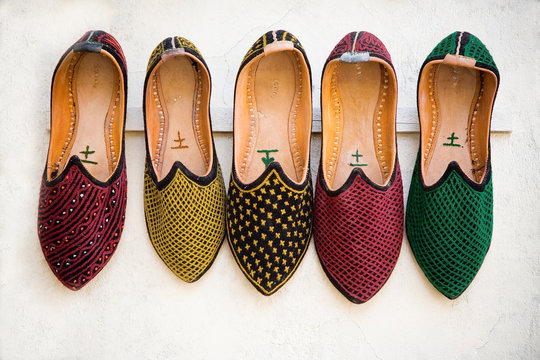 Colorful shoes hanging on rack