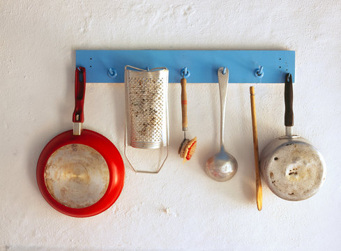 Kitchen utensils hanging on rack