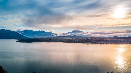 Sunrise over pristine lake with mountains on the background. Wanaka, Otago, South Island, New Zealand