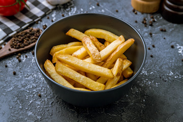 french fries on black plate