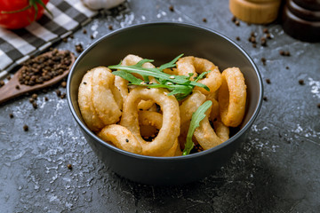 Rings of squid in batter with sauce