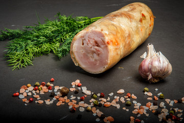 top view chunk of minced meat roll with spices, dill and garlic