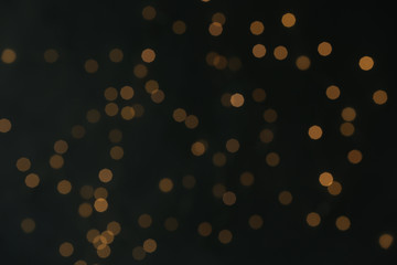 Blurred lights on dark background. Beautiful bokeh effect