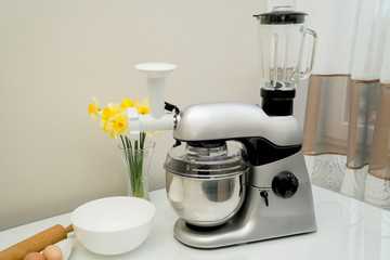 Disassembled multifunctional food processor on kitchen countertops. Modern Liquidiser. Smoothie...