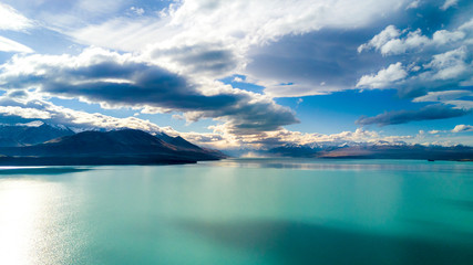 Beautiful lake on a sunny day with mountain peaks on the background. Otago, South Island, New...