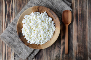 Cottage cheese in a wooden bowl. Farm products. Village Breakfast