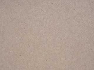 Fototapeta na wymiar Brown cardboard sheet background. Close-up
