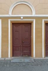 Fototapeta premium Old wooden door entrance in public building