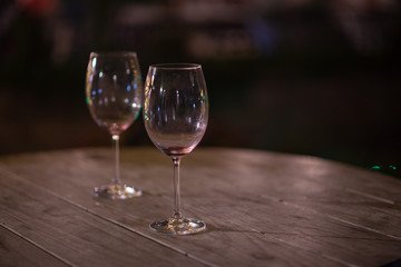 Two empty wine glasses on table