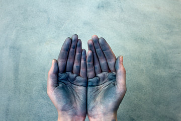 Dirty cupped hands holding something on gray background. - Powered by Adobe