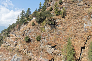 Bhutan, Asia – Buddhist monastery on a steep rock.