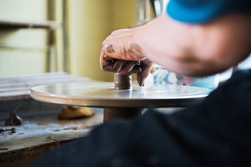 A lace maker and ceramicist create artwork