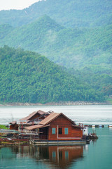 Naklejka premium renovate, under construction wooden floating raft house resort by mountain Kanchanaburi Thailand