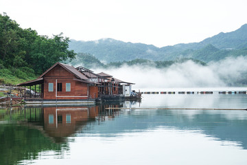 Obraz premium renovate, under construction wooden floating raft house resort by mountain Kanchanaburi Thailand