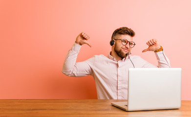 Young man working in a call center feels proud and self confident, example to follow.