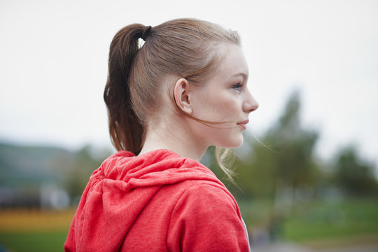 Profile of teenage girl with pigtail