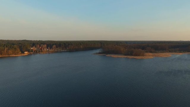 Endless expanses and azure sky. Picturesque exciting wide river water and pine coniferous forest landscape. Rest recreation area. Natural resources and environment. Aerial survey drone view