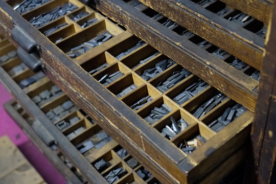 Old wood press printing shop. Case full of letters