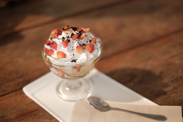 Strawberry topping on ice-cream vanilla