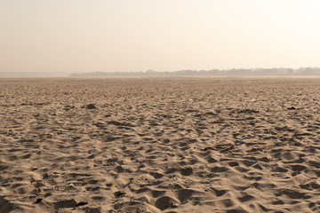 The other side of the Ganges with sand dunes, Land of the dead, Varanasi, India