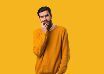 Obraz premium Young natural man biting nails, nervous and very anxious