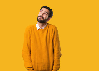 Young natural man dreaming of achieving goals and purposes