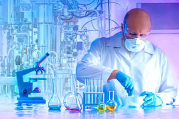 Microbiology laboratory. Man chemist rubs in a mortar reagents. Synthesis of microorganisms in the...
