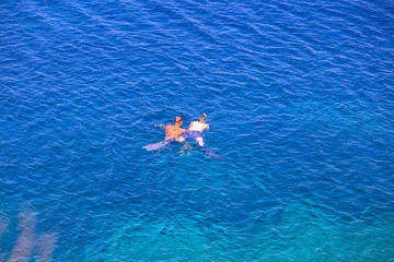 Two guys snorkeling close to Vis island, Croatia