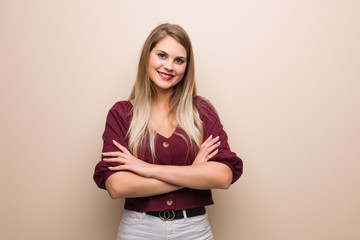 Young russian woman crossing arms, smiling and relaxed