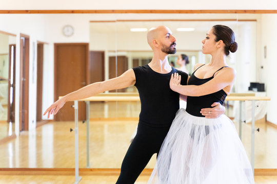 Couple Dancing In Ballet Studio