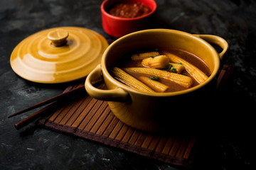 Obraz na płótnie Canvas Baby Corn Manchurian with gravy - popular Indo-chinese recipe. selective focus