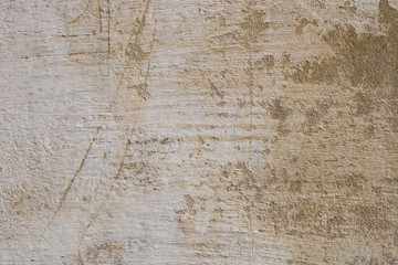 Fototapeta premium old obsolete beige plastered wall background texture