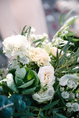 beautiful wedding bouquet of white flowers lies