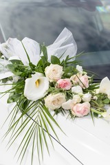 white wedding limousine with flower decoration close up