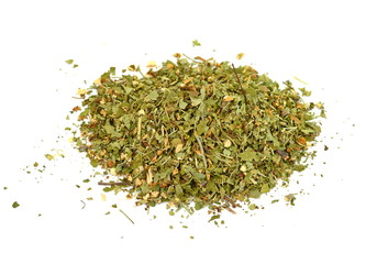 Pile of dried oregano isolated on white. Pile of dried oregano leaves on a white background. Spice for pizza. Pizza ingredient.