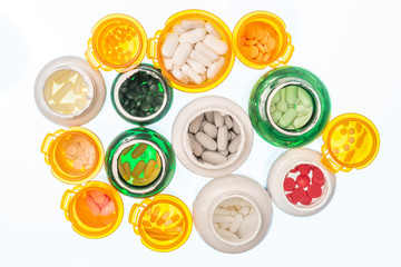 Open Medicine Bottles From Above On White